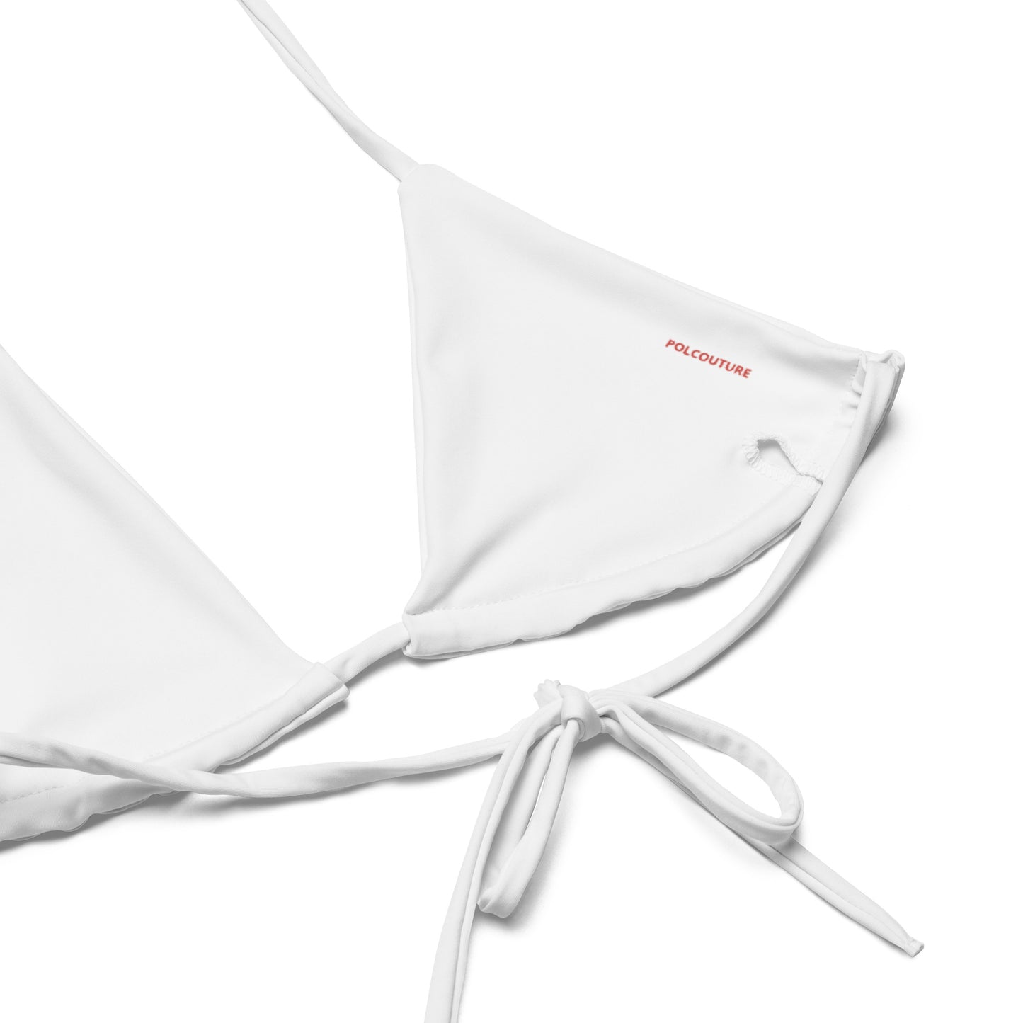 Nahaufnahme des Bikini-Oberteils „MAKI“ innen. Fokus auf das Material und den detailreichen Druck der roten Mohnblume.