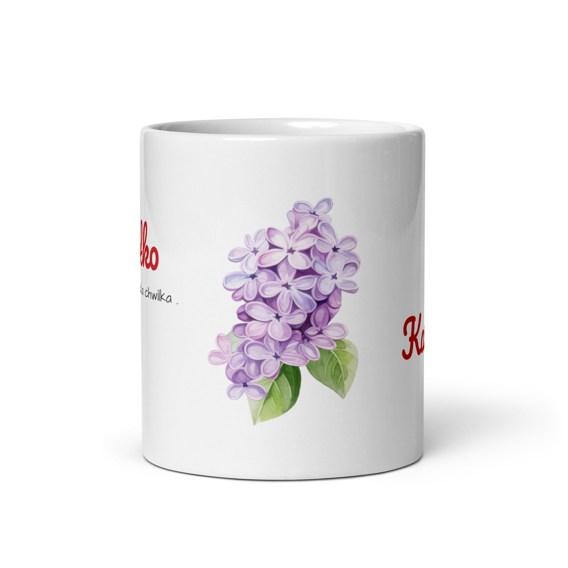 Vorderansicht der weißen, glänzenden kleineren Tasse von POLCOUTURE. Das Design besticht durch ein elegantes Arrangement aus fliederfarbenen Blüten und grünen Blättern.